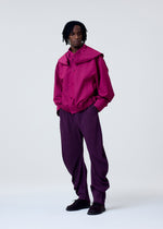A model wears the HOMME PLISSE ISSEY MIYAKE CARRIER CARRIED prêt à porter.