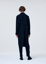 A model wears the Homme Plisse Issey Miyake TUXEDO PLEATS prêt à porter.