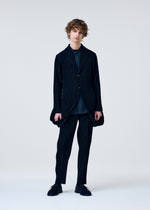 A model wears the Homme Plisse Issey Miyake TUXEDO PLEATS prêt à porter.