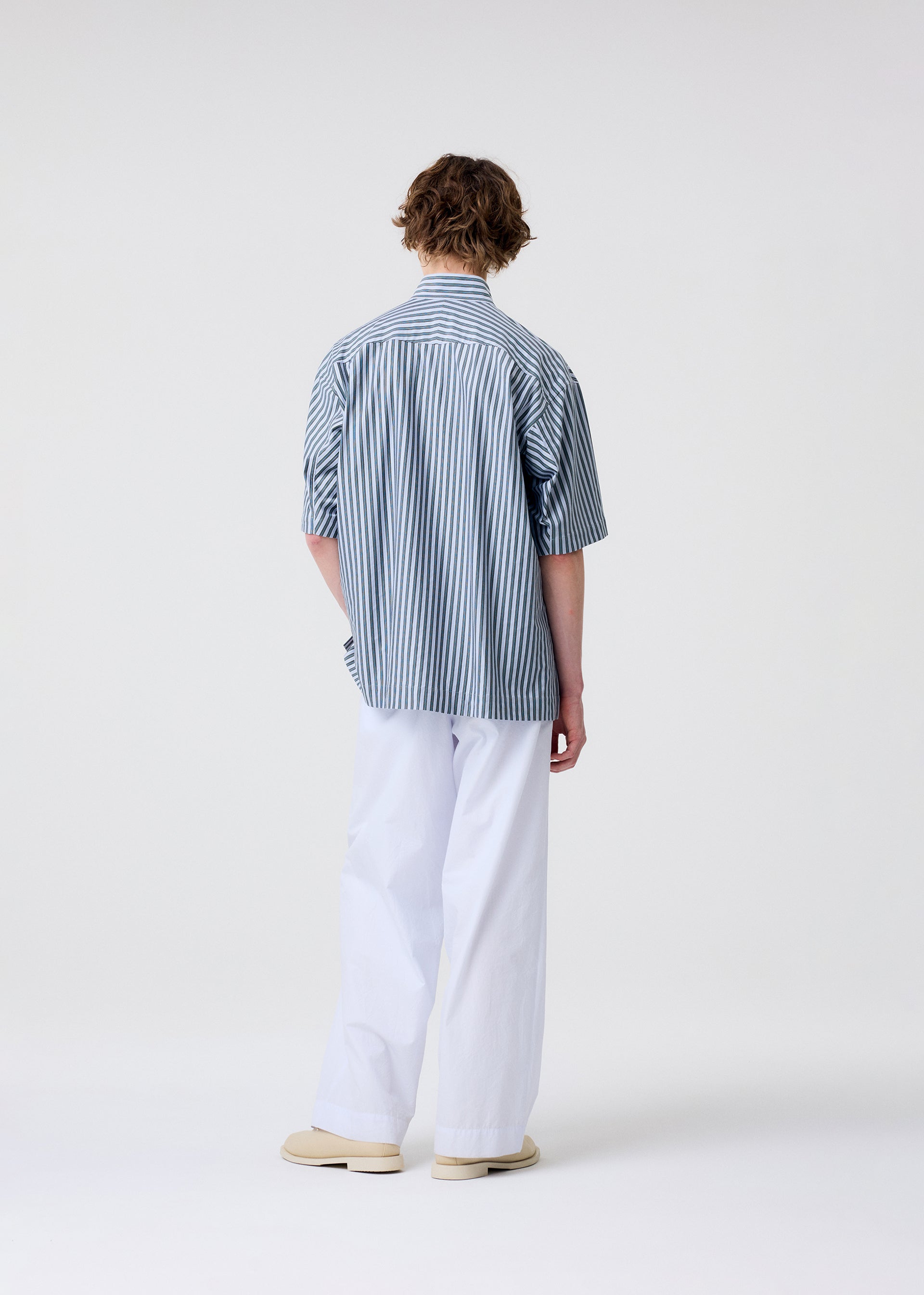 A model wears the Homme Plisse Issey Miyake FRESHEN pants.