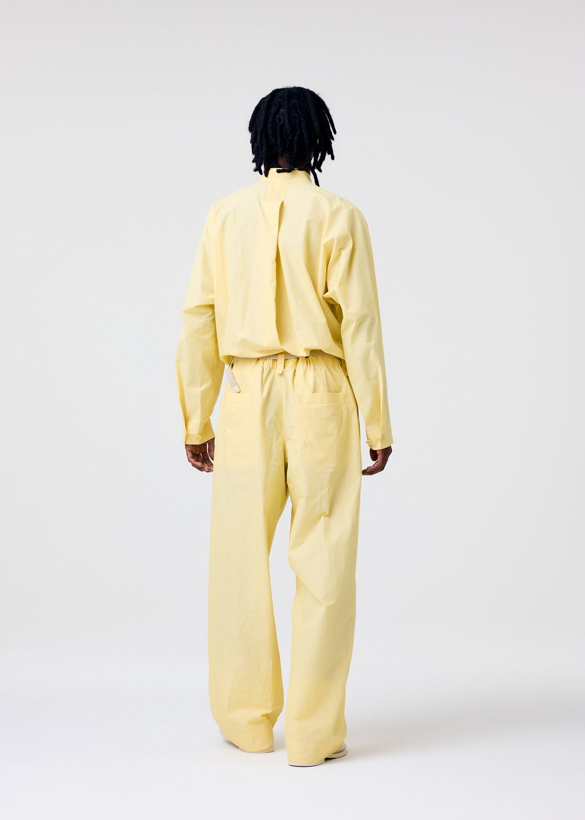 A model wears the Homme Plisse Issey Miyake FRESHEN jumpsuit.