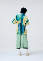 A model wears the Homme Plisse Issey Miyake DAWN EDGE SHIRT shirt.