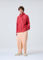 A model wears the HOMME PLISSE ISSEY MIYAKE STREAMLINE SHIRT prêt à porter.