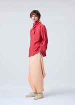 A model wears the HOMME PLISSE ISSEY MIYAKE STREAMLINE SHIRT prêt à porter.