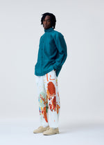 A model wears the HOMME PLISSE ISSEY MIYAKE CRYSTALLINE WOOL BLEND prêt à porter.