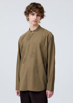 A model wears the Homme Plisse Issey Miyake EMBROIDERY PRESS SHIRT prêt à porter.