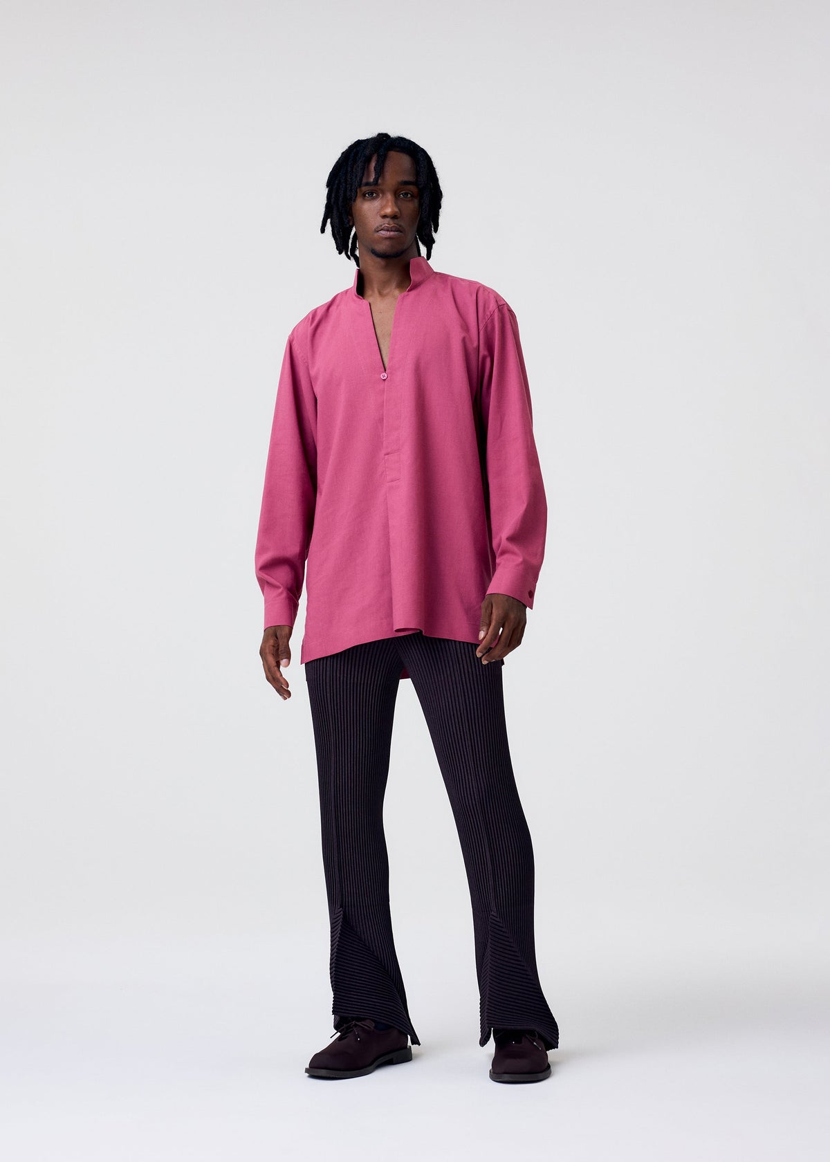 A model wears the Homme Plisse Issey Miyake PL RAMIE SHIRT shirt.