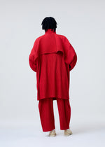 A model wears the HOMME PLISSE ISSEY MIYAKE COVER AND FOLD prêt à porter.