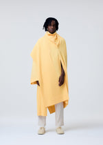 A model wears the Homme Plisse Issey Miyake WEAR OR WRAP prêt à porter.