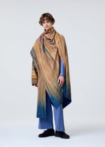 A model wears the Homme Plisse Issey Miyake PAINT BRUSH CLOSE UP prêt à porter.