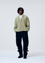A model wears the HOMME PLISSE ISSEY MIYAKE COVER AND FOLD prêt à porter.