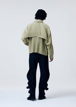 A model wears the HOMME PLISSE ISSEY MIYAKE COVER AND FOLD prêt à porter.