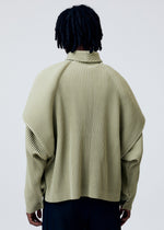 A model wears the HOMME PLISSE ISSEY MIYAKE COVER AND FOLD prêt à porter.