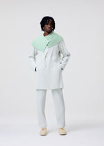A model wears the HOMME PLISSÉ ISSEY MIYAKE TAILORED PLEATS 3 tailored-pleats-3-jacket-duomo-green-1.