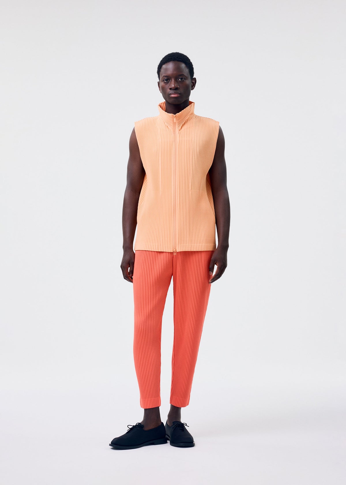 A model wears the Homme Plisse Issey Miyake MONTHLY COLORS   APRIL vest.