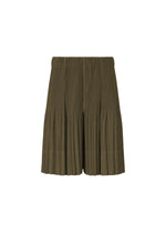 A product shot of the HOMME PLISSÉ ISSEY MIYAKE MONTHLY COLORS : JUNE trousers in genova metal ocher.