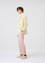 A model wears the Homme Plisse Issey Miyake COLOR PLEATS 2 trousers.