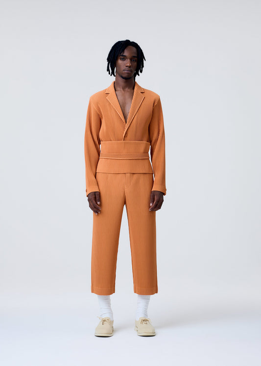 A model wears the Homme Plisse Issey Miyake TAILORED PLEATS 2 pants.