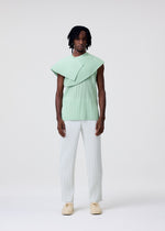 A model wears the HOMME PLISSÉ ISSEY MIYAKE TAILORED PLEATS 3 tailored-pleats-3-trousers-duomo-green.