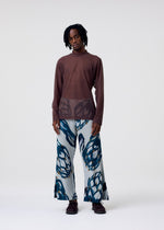 A model wears the Homme Plisse Issey Miyake FRUITS VEGETABLES pants.