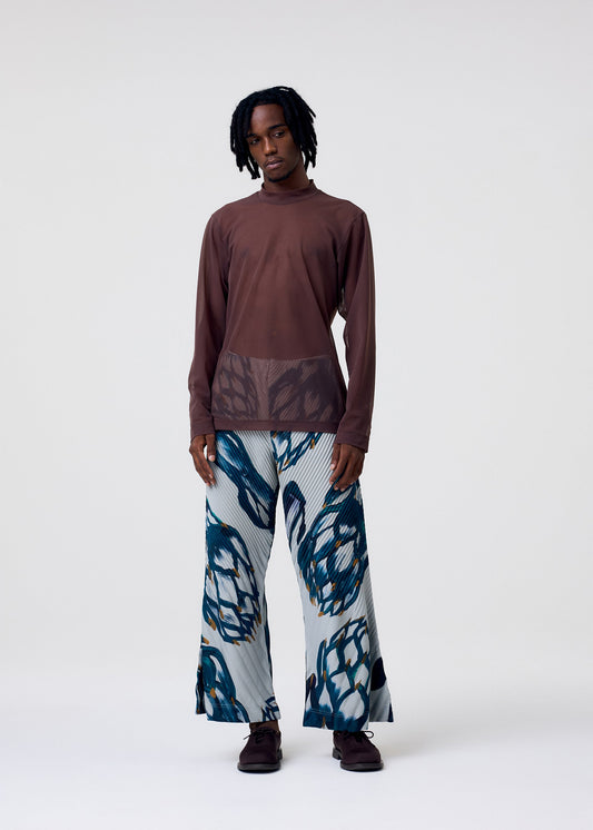A model wears the Homme Plisse Issey Miyake FRUITS VEGETABLES pants.