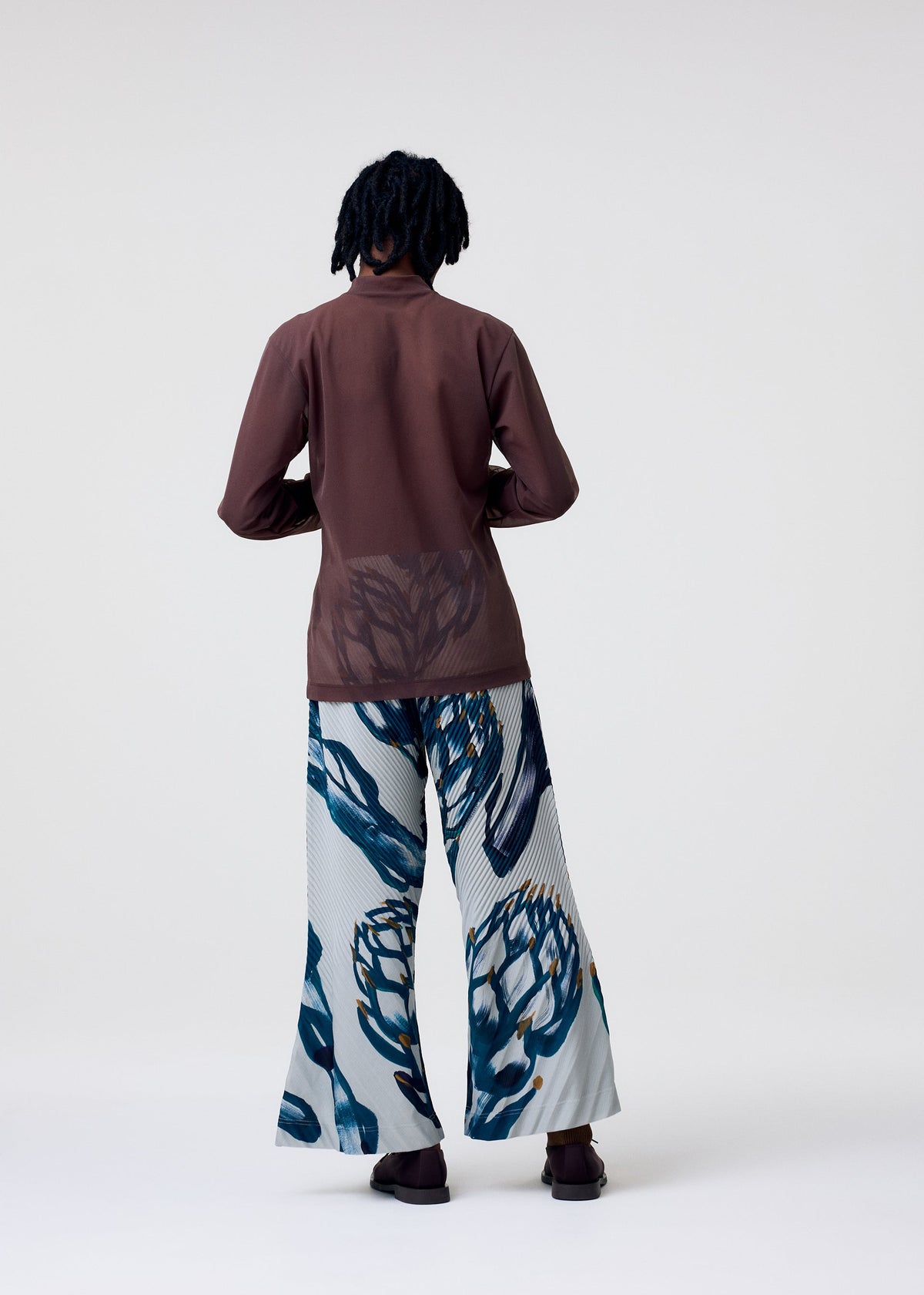 A model wears the Homme Plisse Issey Miyake FRUITS VEGETABLES pants.
