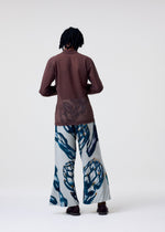 A model wears the Homme Plisse Issey Miyake FRUITS VEGETABLES pants.