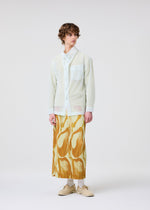 A model wears the Homme Plisse Issey Miyake FRUITS VEGETABLES skirt.