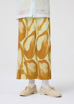 A model wears the Homme Plisse Issey Miyake FRUITS VEGETABLES skirt.