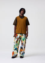 A model wears the HOMME PLISSÉ ISSEY MIYAKE MONTHLY COLORS : JUNE monthly-colors-june-t-shirt-boboli-moss-ash.