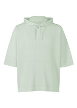 A product shot of the HOMME PLISSÉ ISSEY MIYAKE MONTHLY COLORS : JUNE t-shirt in boboli moss ash.