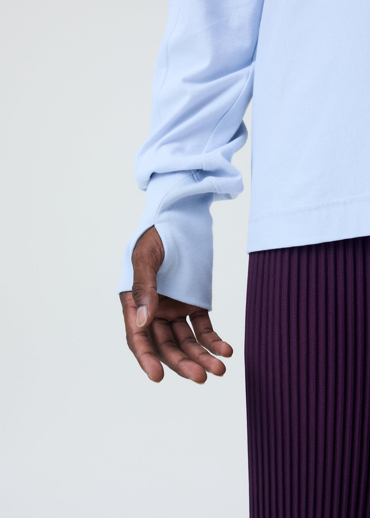 A model wears the HOMME PLISSE ISSEY MIYAKE RELEASE T 1 prêt à porter.