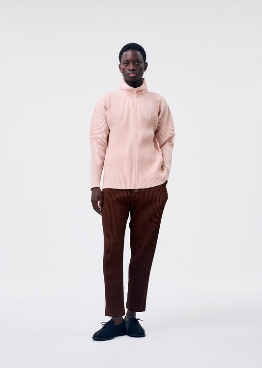 A model wears the Homme Plisse Issey Miyake COLOR PLEATS 2 jacket.