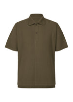 A product shot of the HOMME PLISSÉ ISSEY MIYAKE MONTHLY COLORS : JUNE polo shirt in genova metal ocher.