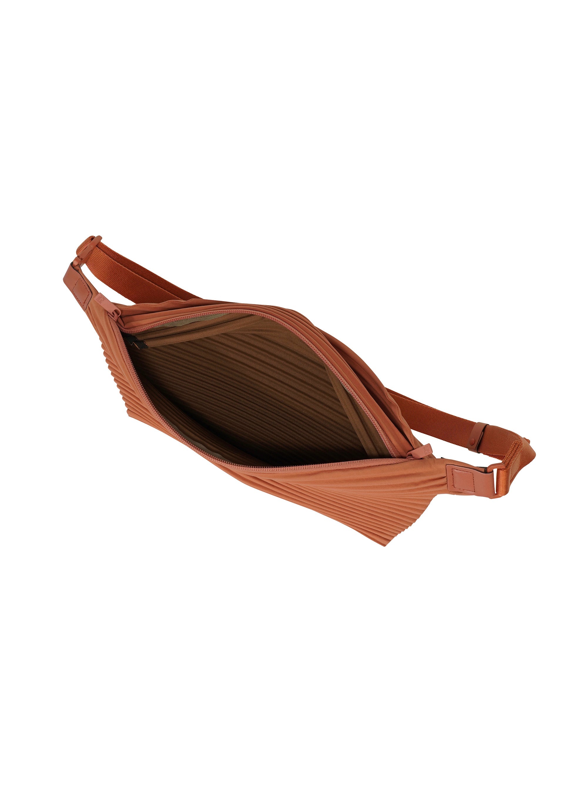 A detail shot of the HOMME PLISSÉ ISSEY MIYAKE PLEATS SLIM BAG bag.