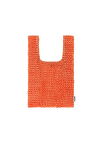 A product shot of the HOMME PLISSÉ ISSEY MIYAKE MESH PLEATS BAG bag in orange.