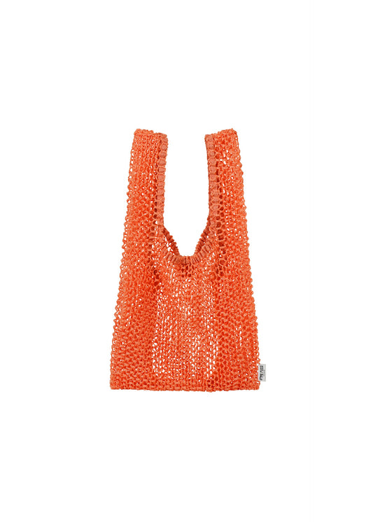 A detail shot of the HOMME PLISSÉ ISSEY MIYAKE MESH PLEATS BAG bag.