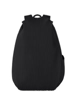 A product shot of the HOMME PLISSÉ ISSEY MIYAKE PLEATS BACKPACK bag in black.