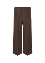 A product shot of the HOMME PLISSÉ ISSEY MIYAKE KERSEY PLEATS trousers in brown.