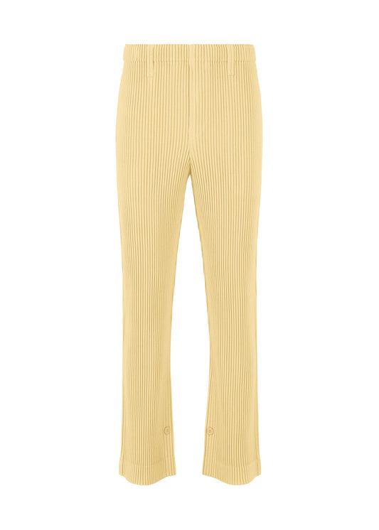 A product shot of the HOMME PLISSÉ ISSEY MIYAKE KERSEY PLEATS trousers in cream yellow.
