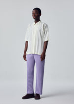 A model wears the HOMME PLISSÉ ISSEY MIYAKE EDGE SHIRT edge-shirt-shirt-white-fw26.