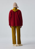 A model wears the HOMME PLISSÉ ISSEY MIYAKE FLEECE PLEATS blouson.