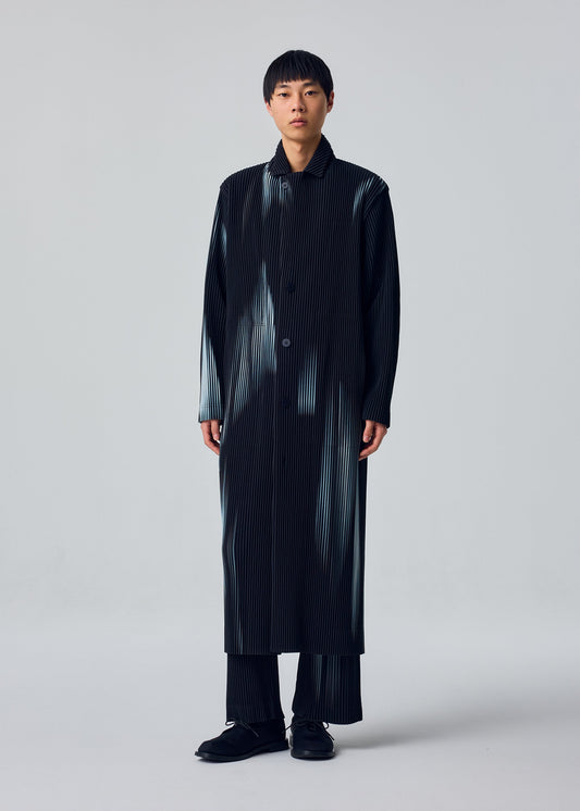 A model wears the HOMME PLISSÉ ISSEY MIYAKE IN THE SHADOW jacket.