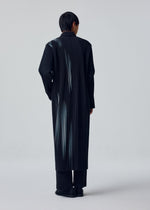A model wears the HOMME PLISSÉ ISSEY MIYAKE IN THE SHADOW jacket.