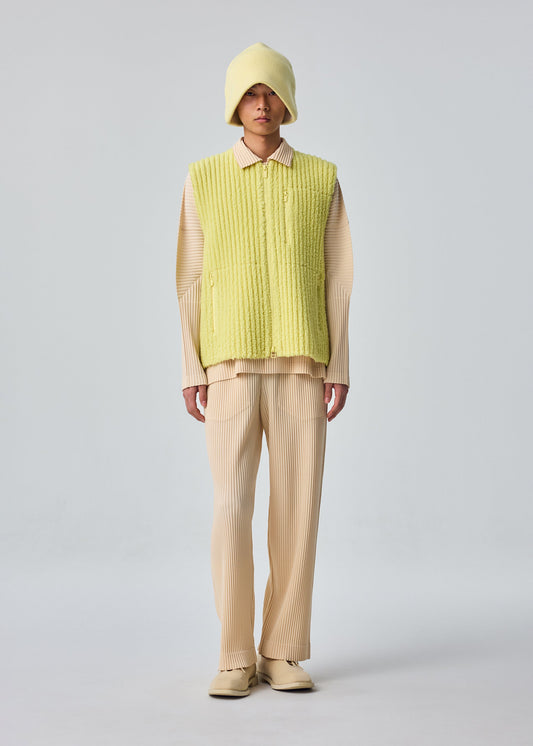 A model wears the HOMME PLISSÉ ISSEY MIYAKE FLEECE PLEATS vest.