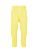 A product shot of the HOMME PLISSÉ ISSEY MIYAKE MONTHLY COLORS : AUGUST pants in shine yellow.