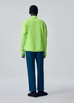 A model wears the HOMME PLISSÉ ISSEY MIYAKE TAILORED PLEATS 1 tailored-pleats-1-trousers-shadow-blue.