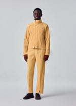 A model wears the HOMME PLISSÉ ISSEY MIYAKE TAILORED PLEATS 1 tailored-pleats-1-trousers-black-10.