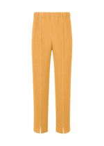 A product shot of the HOMME PLISSÉ ISSEY MIYAKE TAILORED PLEATS 1 pants in glow orange.