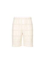 A product shot of the HOMME PLISSÉ ISSEY MIYAKE LACE GRID PLEATS pants in white.
